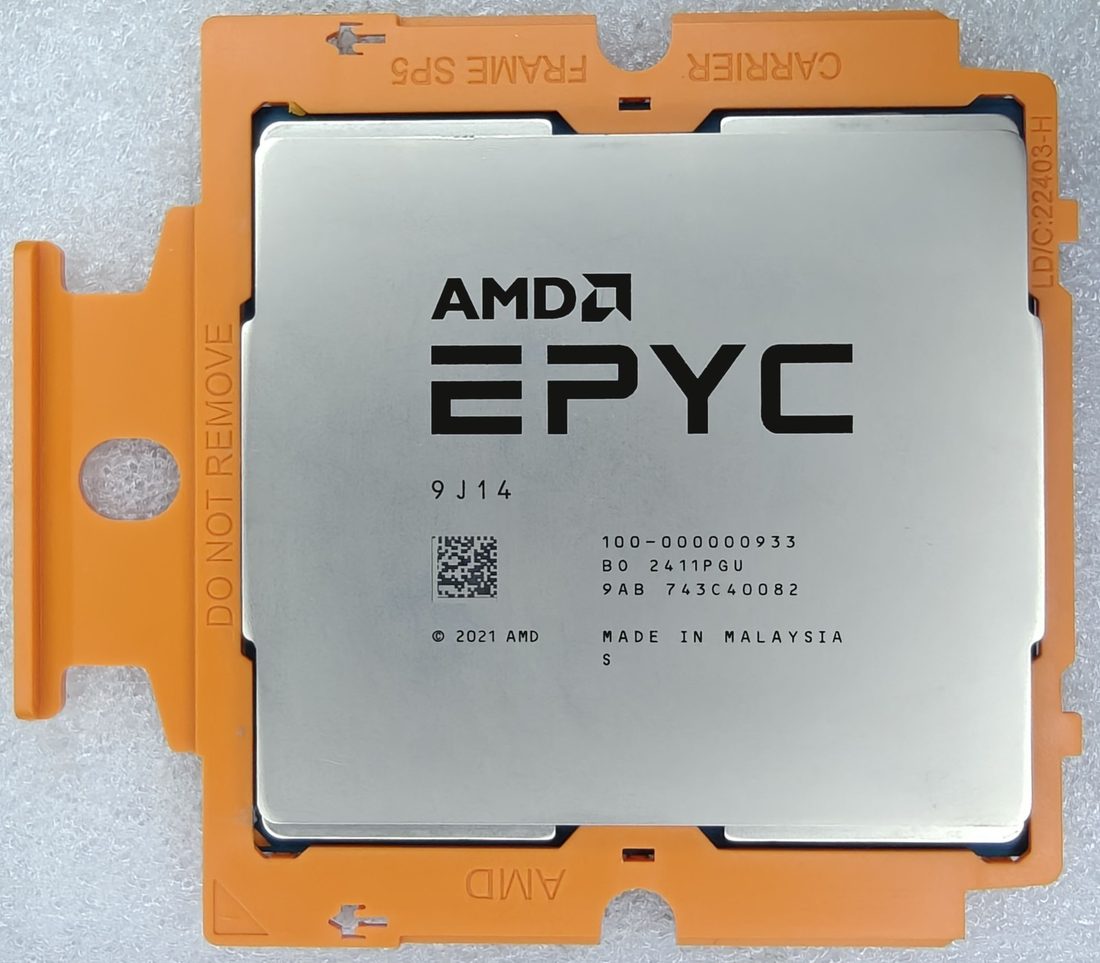 AMD EPYC processor, top face, laser-etched markings - photographed on a plain surface