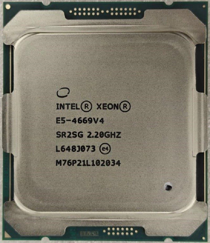 Intel Xeon E5-4669 v4 processor, top face, laser-etched markings - photographed on a plain surface