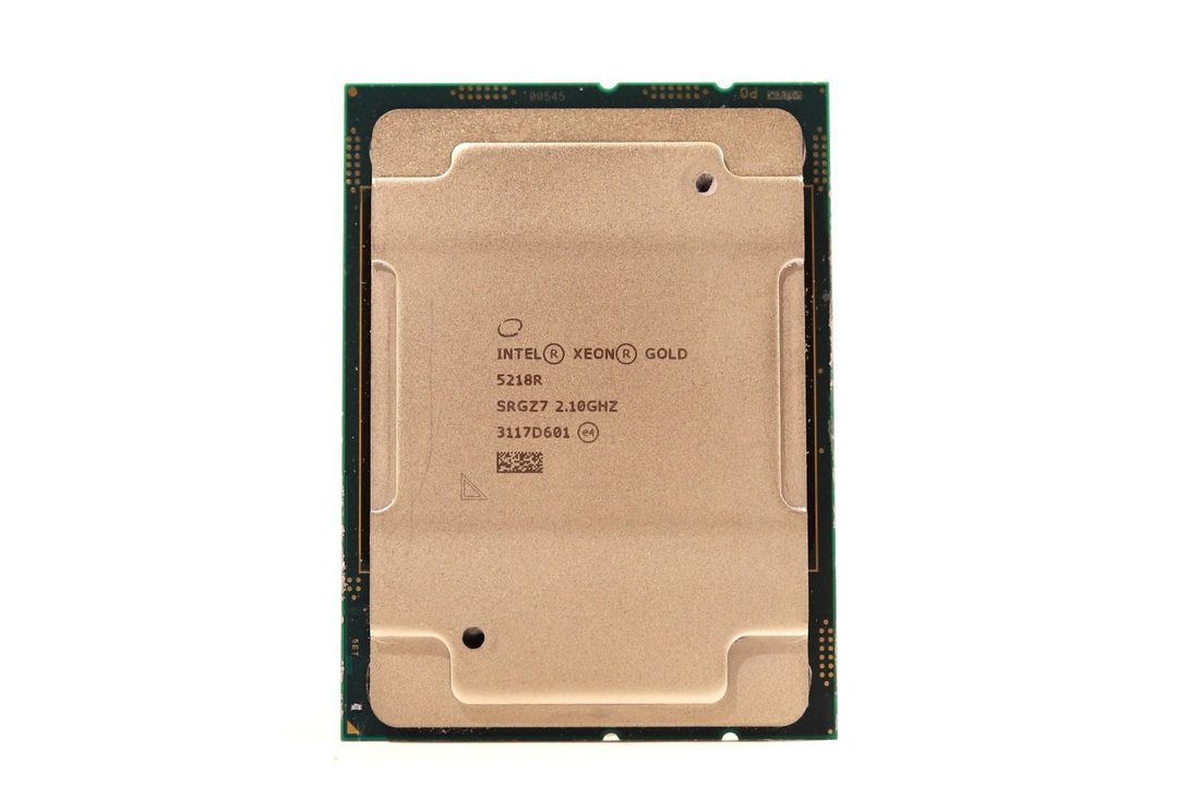 Intel Xeon Gold 5218R processor, top face, laser-etched markings - photographed on a plain surface