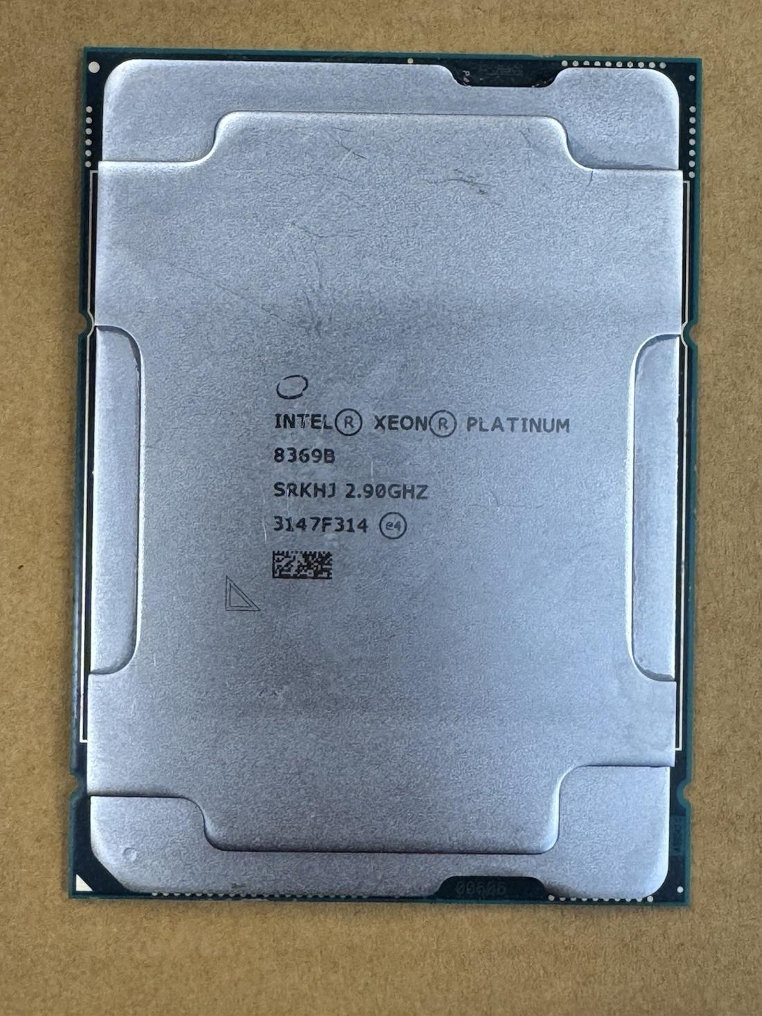 Intel Xeon processor, top face, laser-etched markings - photographed on a plain surface