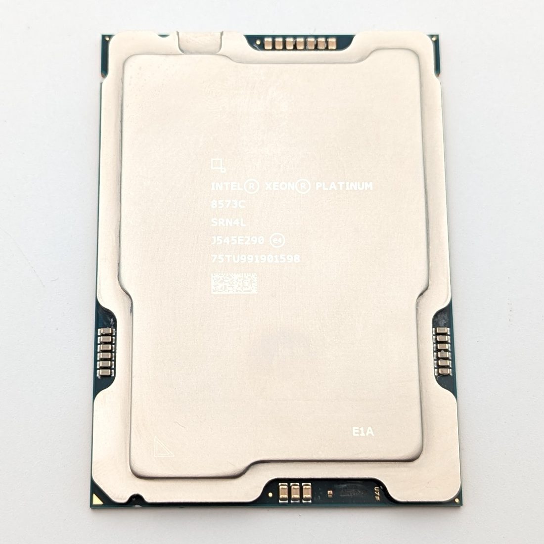 Intel Xeon Platinum 8573C processor, top face, laser-etched markings reading