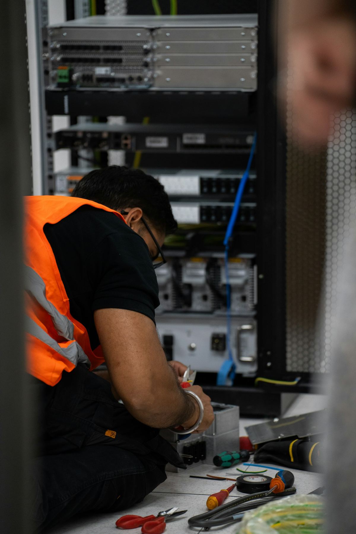 Technician performing hands-on work on enterprise hardware